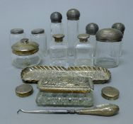 A quantity of various silver and silver-mounted dressing table items. The tray 22 cm long. 198.
