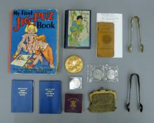 A quantity of miscellaneous items including a tin, a purse, books etc. The purse 10 cm wide.
