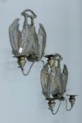 A pair of bronze bat-form sconces. 34.5 cm high.