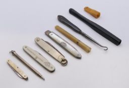 A quantity of miscellaneous items, including penknives, cigarette/cheroot holders,