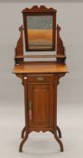 A Victorian walnut dressing stand. 56 cm wide x 157 cm high.