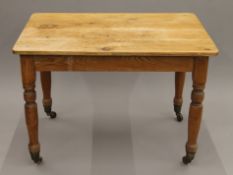 A Victoria pine kitchen table. 74 cm x 106 cm.