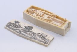 A bone scrimshaw coffin enclosing a skeleton, the coffin lid depicting a whaling scene. Coffin 11.