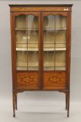 An Edwardian inlaid mahogany display cabinet. 91 cm wide x 172.5 cm high.