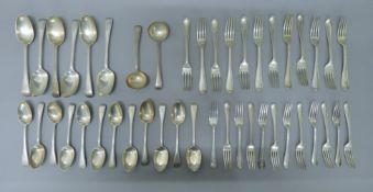 A 12-setting silver dinner service. The tablespoons 22.5 cm long. 100 troy ounces.
