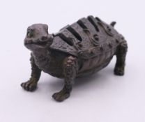 A bronze turtle form censor. 5 cm long, 3.5 cm high.