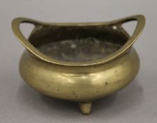 A small Chinese bronze censer. 8 cm wide.