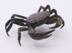 A bronze articulated crab. 10 cm wide, 9 cm deep, 4 cm high.