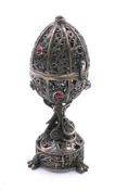 A 19th century Russian 84 silver openwork filigree egg casket set with cabochons,