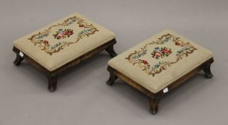 A pair of tapestry upholstered stools. Each 38 cm long.