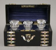 A 19th century mother-of-pearl and ebonised dome-shaped scent bottle casket,