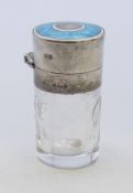 A Victorian scent bottle with etched glass body and enamel and silver top with original stopper.
