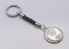 A boxed Rolex keyring stamped 'BASELWORLD 2016'. 13 cm high.