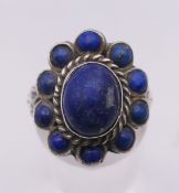 A silver and lapis ring. Ring size N.