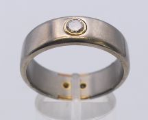 An unmarked 18 ct gold, silver and diamond ring. Ring size X.
