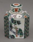 A 15th century Chinese porcelain famille verte octagonal tea canister and lid decorated with