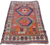A Middle Eastern red ground rug. 234 x 160 cm.