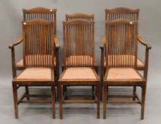 A set of six early 20th century oak dining chairs. The carvers each 58 cm wide.