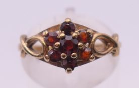 A 9 ct gold and garnet ring. Ring size L/M 2.2 Grammes total weight.