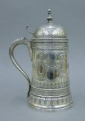 A 1986 Franklin Mint silver-plated lidded tankard. 25 cm high.