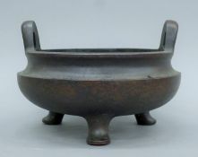 A large Chinese bronze censer. 23 cm wide.