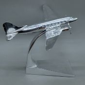 An aluminium model of an aeroplane. 39 cm long.