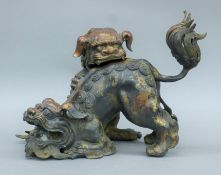 A Chinese bronze double dog-of-fo censer. 25 cm high.