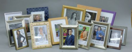 A collection of various signed celebrity photographs, including Robert Lindsay, Angus Deayton,