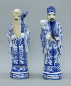 A pair of Chinese blue and white porcelain figures. The larger 32 cm high.