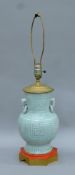 A Chinese celedon porcelain lamp. 69 cm high overall.