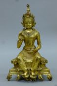 A gilt bronze figure of Buddha. 24 cm high.