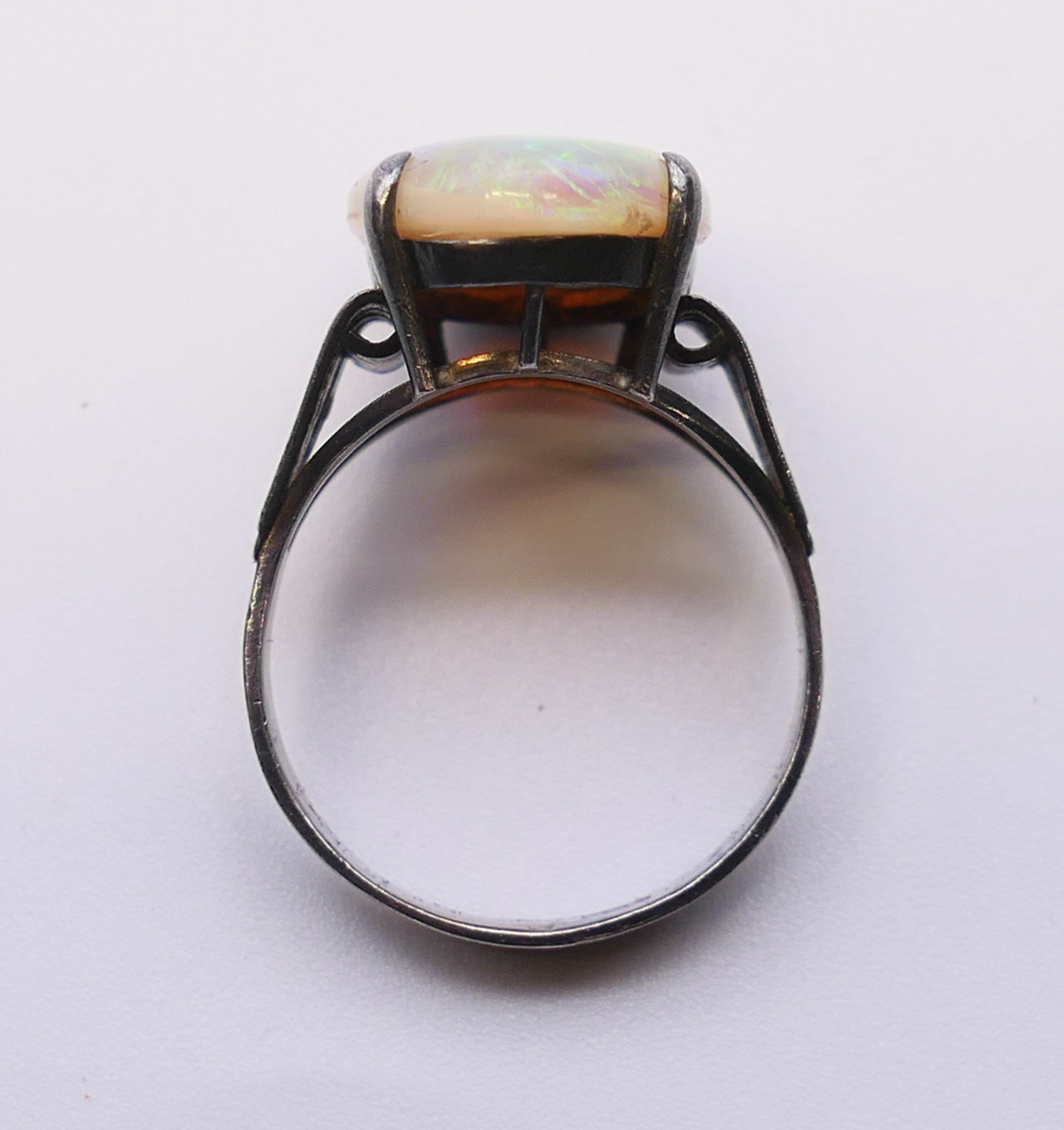 A silver and opal ring. The opal 1.8 cm x 1.2 cm. Ring size S. - Image 5 of 5