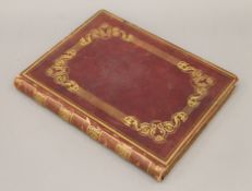 An album of 36 window-mounted Spanish costume plates, 33 hand coloured, folio, full red morocco.