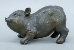 A bronze model of a piglet. 11 cm long.