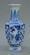 A Chinese blue and white hexagonal porcelain vase. 24 cm high.