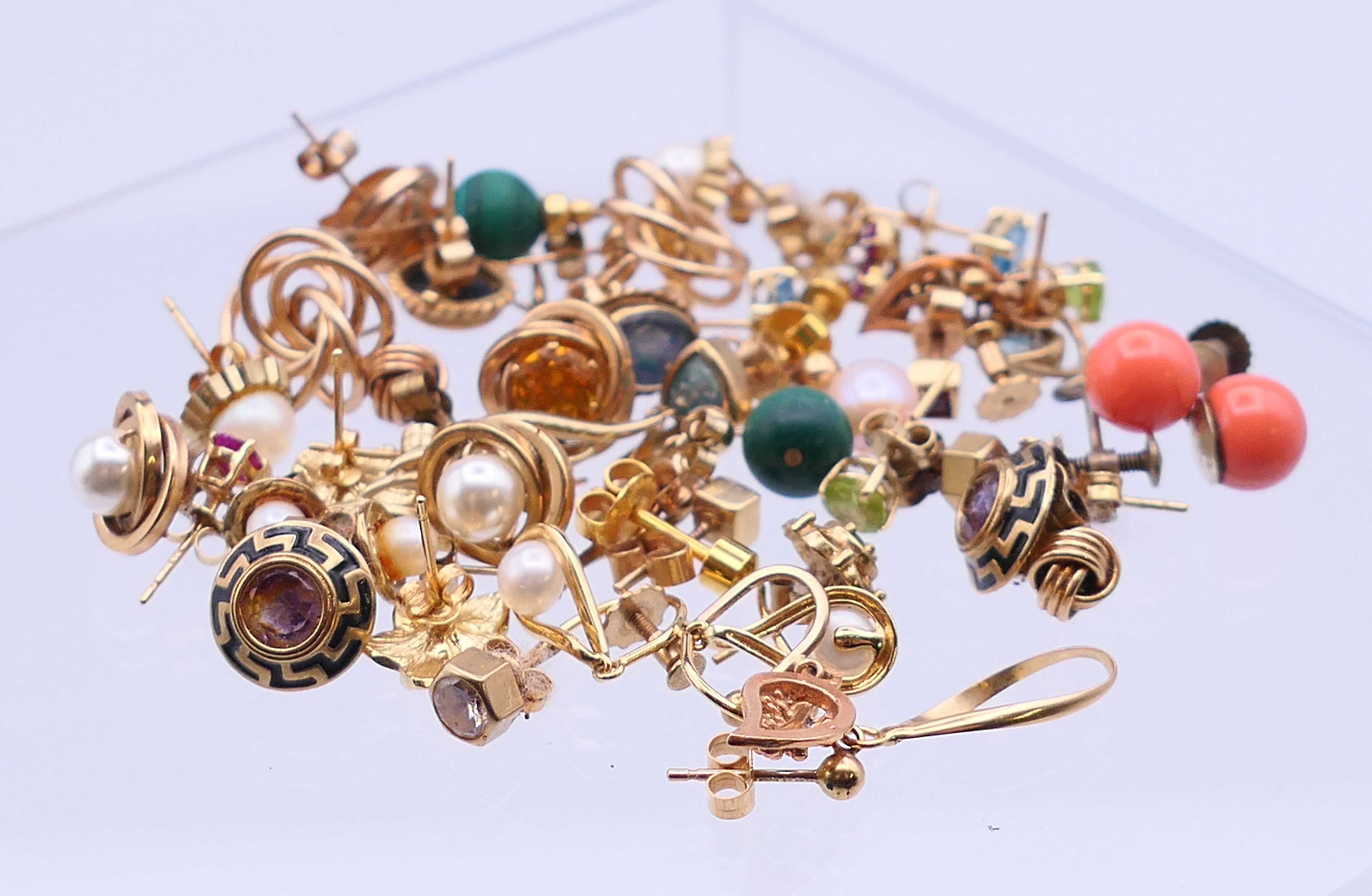 A quantity of various gold and other earrings. The coral pair 8 mm high. 34.6 grammes total weight.