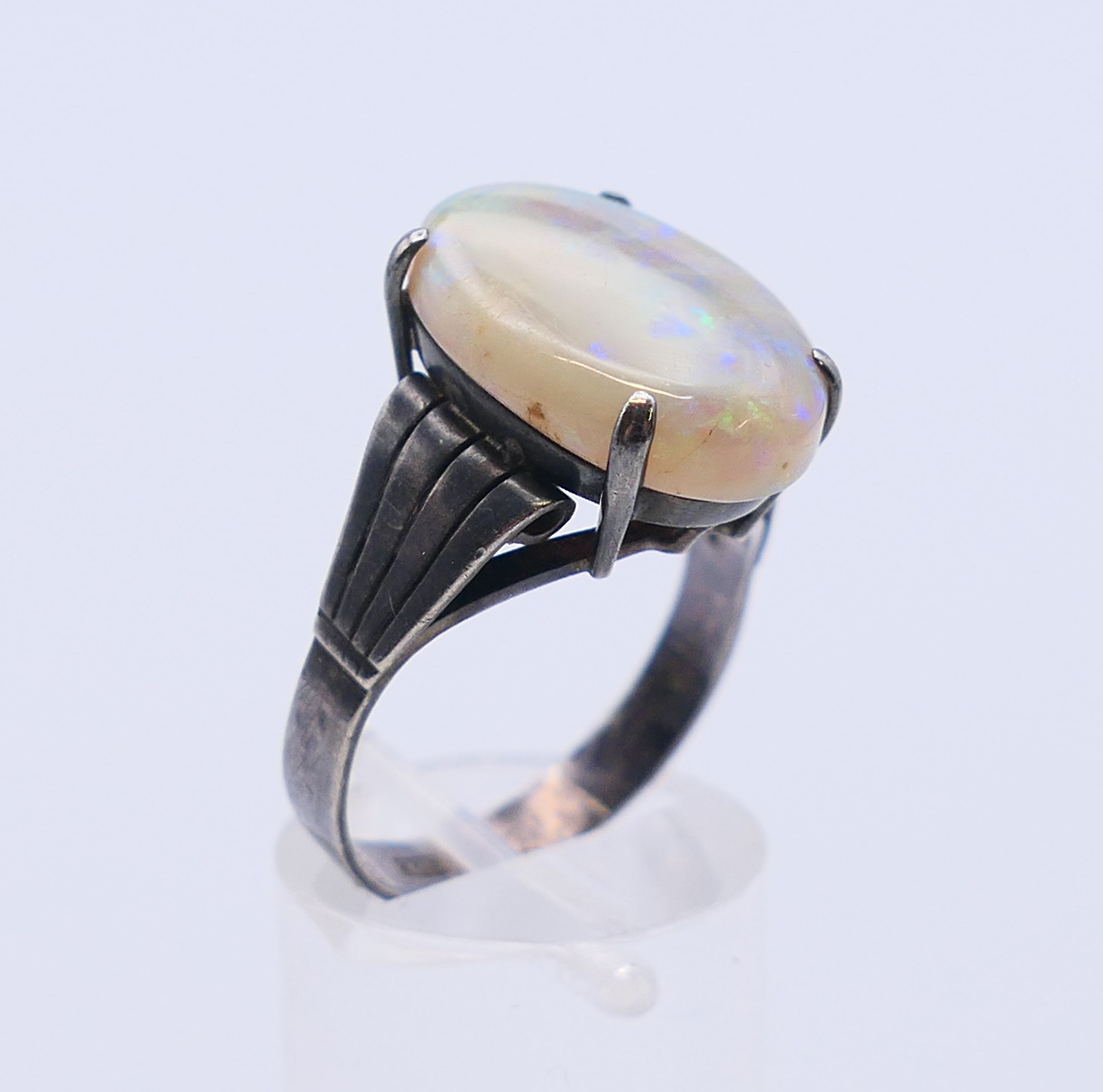 A silver and opal ring. The opal 1.8 cm x 1.2 cm. Ring size S. - Image 3 of 5