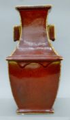 A Chinese sang-de-boeuf pottery vase. 37.5 cm high.