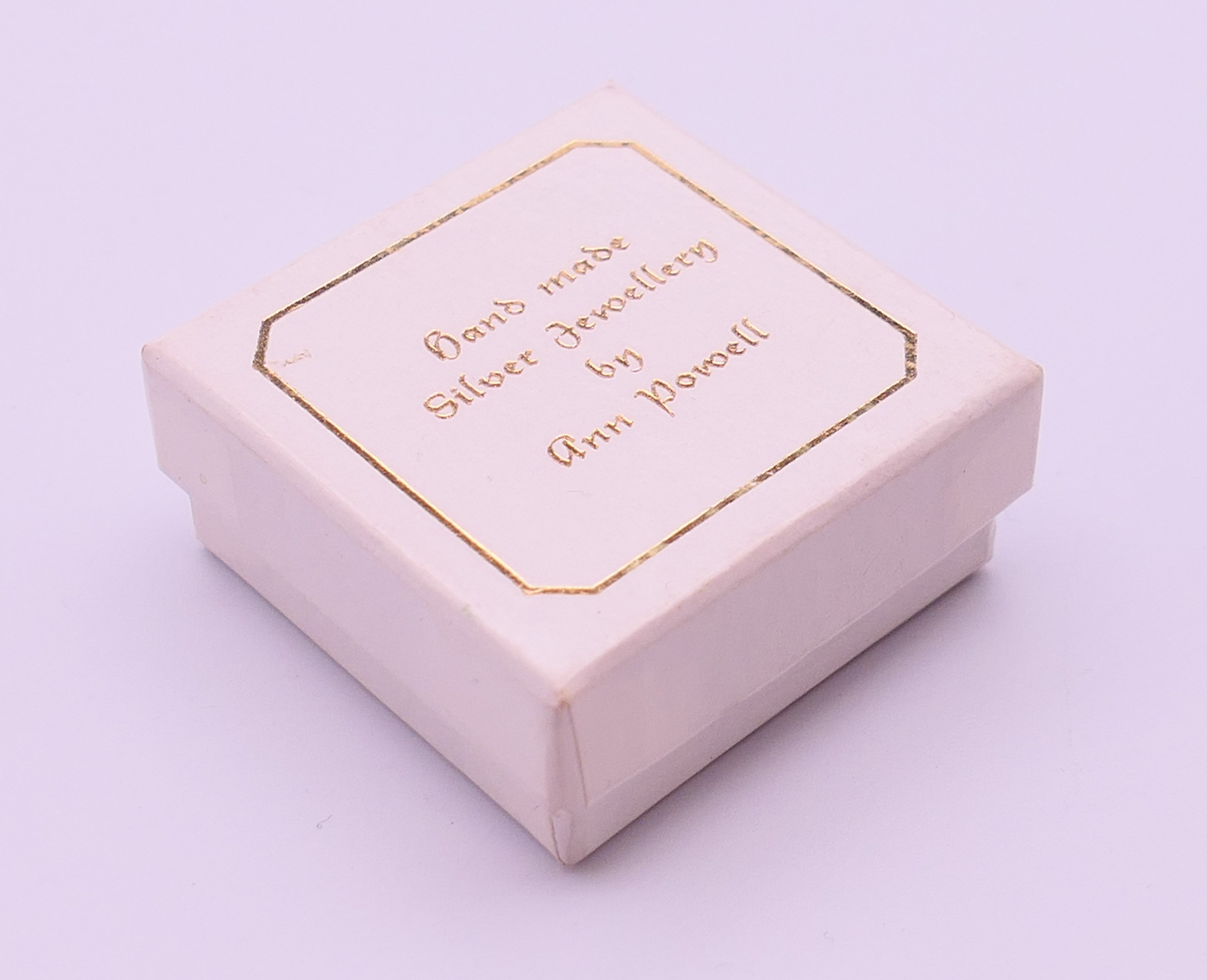 An Ann Powell handmade one-off silver, gold and mother-of-pearl brooch decorated with a lily. 3. - Image 5 of 5