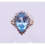 A 9 ct white gold and blue topaz ring. Ring size O.