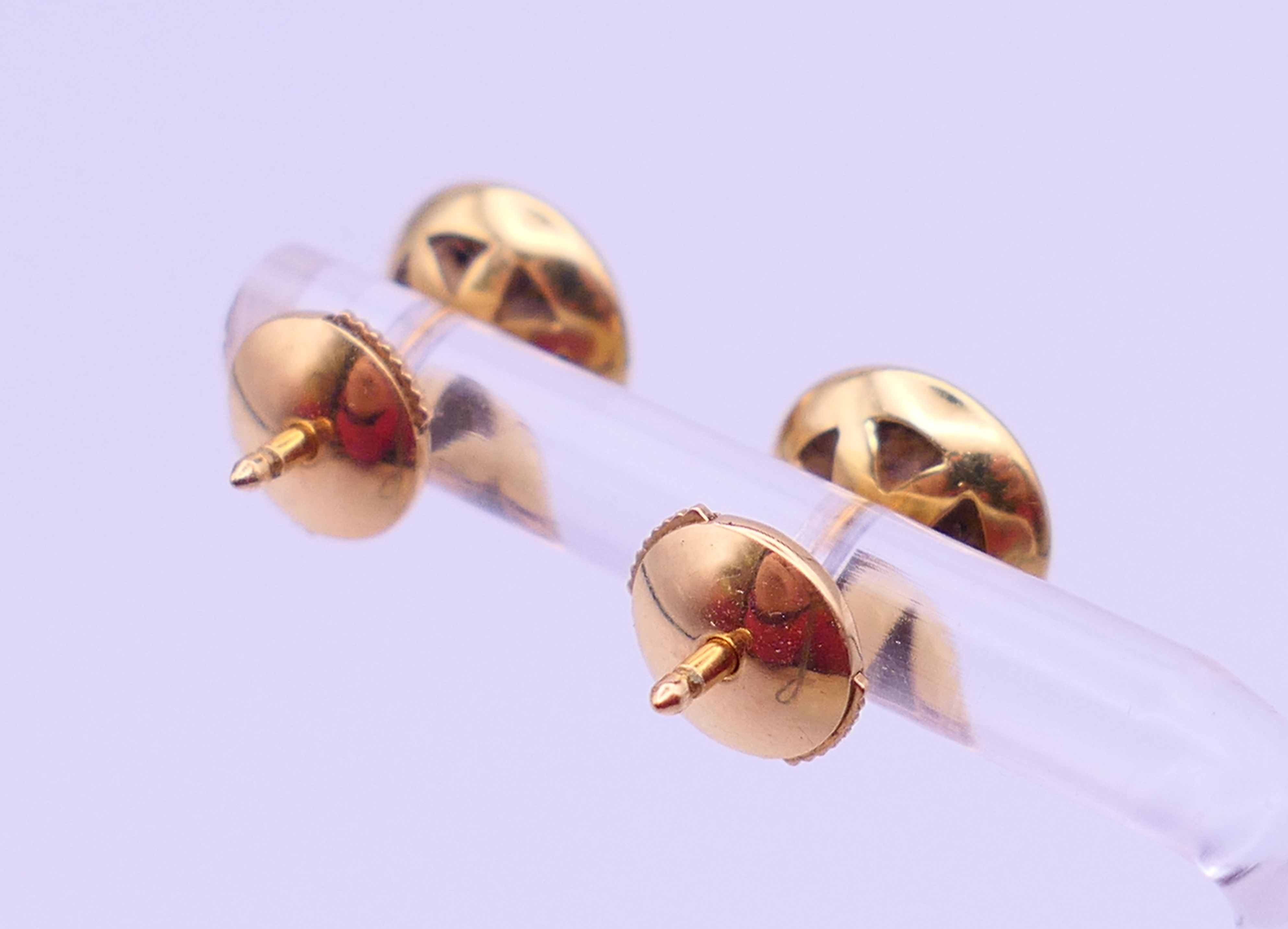 A pair of 18 ct gold and diamond ear studs, each stone approximately 0.25 ct. Each 8 mm diameter. 3. - Image 3 of 5