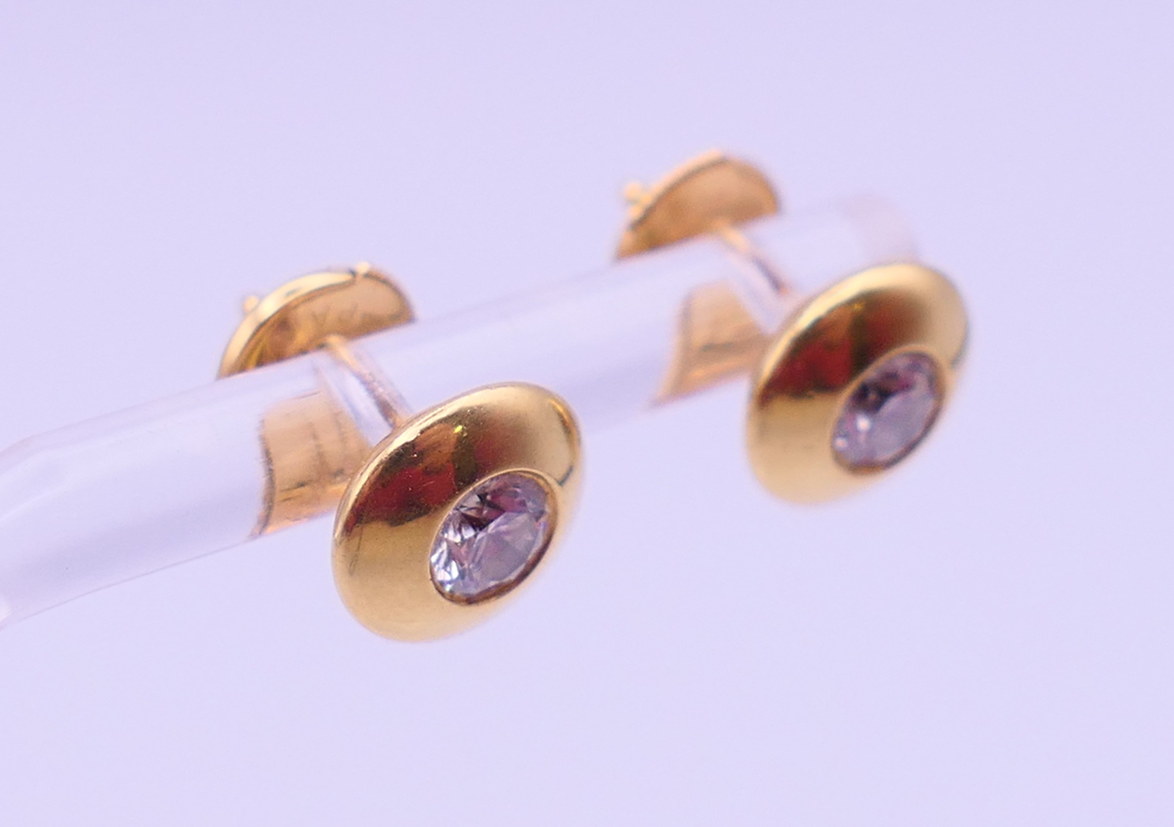 A pair of 18 ct gold and diamond ear studs, each stone approximately 0.25 ct. Each 8 mm diameter. 3. - Image 2 of 5