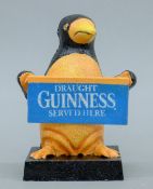 A cast iron 'Guinness' penguin. 16 cm high.