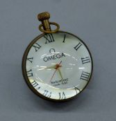 A ball clock. 6 cm high.