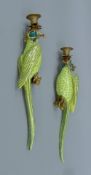 A pair of gilt metal-mounted porcelain parrot-form wall sconces. Each 47 cm high.