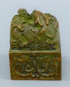 A Chinese bronze seal surmounted with dragons. 7.5 cm high.
