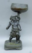 A 19th century Japanese bronze censer formed as a deity. 58 cm high.