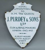 An enamel 'Purdey' sign. 51 cm high.