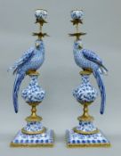 A pair of gilt-mounted blue and white porcelain bird-form candlesticks. Each 49 cm high.