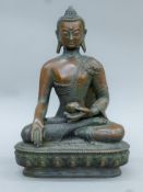 A seated bronze figure of Buddha. 31 cm high.